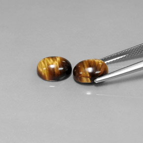 Gemas de tiger's eye marrón natural de  ct, corte óvalo, opaco