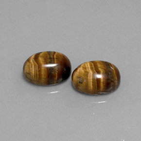 Gemas de tiger's eye marrón natural de  ct, corte óvalo, opaco