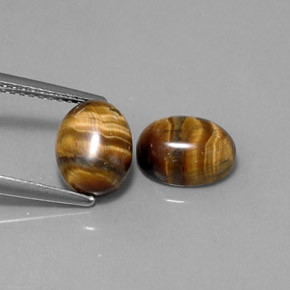Gemas de tiger's eye marrón natural de  ct, corte óvalo, opaco