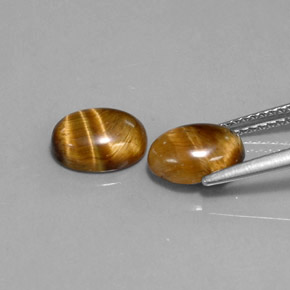 Gemas de tiger's eye marrón natural de  ct, corte óvalo, opaco