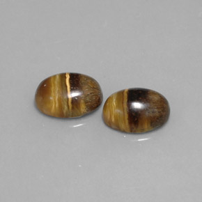 Gemas de tiger's eye marrón natural de  ct, corte óvalo, opaco