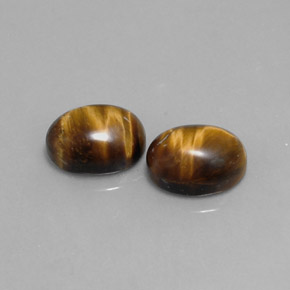 Gemas de tiger's eye marrón natural de  ct, corte óvalo, opaco