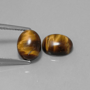 Gemas de tiger's eye marrón natural de  ct, corte óvalo, opaco