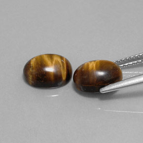Gemas de tiger's eye marrón natural de  ct, corte óvalo, opaco