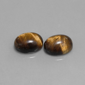 Gemas de tiger's eye marrón natural de  ct, corte óvalo, opaco