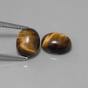 Gemas de tiger's eye marrón natural de  ct, corte óvalo, opaco