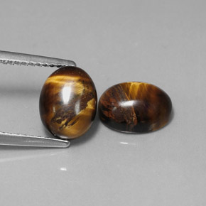 Gemas de tiger's eye marrón natural de  ct, corte óvalo, opaco