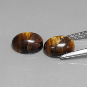 Gemas de tiger's eye marrón natural de  ct, corte óvalo, opaco
