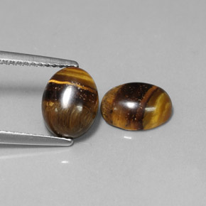 Gemas de tiger's eye marrón natural de  ct, corte óvalo, opaco