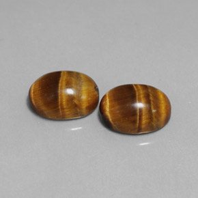 Gemas de tiger's eye marrón natural de  ct, corte óvalo, opaco
