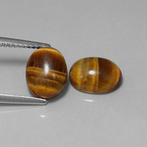 Gemas de tiger's eye marrón natural de  ct, corte óvalo, opaco
