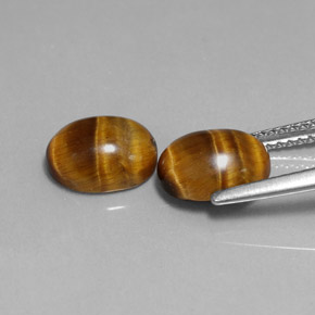 Gemas de tiger's eye marrón natural de  ct, corte óvalo, opaco