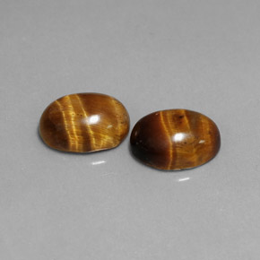 Gemas de tiger's eye marrón natural de  ct, corte óvalo, opaco