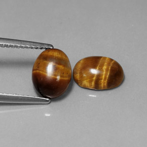 Gemas de tiger's eye marrón natural de  ct, corte óvalo, opaco