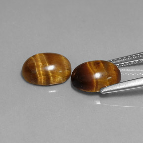 Gemas de tiger's eye marrón natural de  ct, corte óvalo, opaco