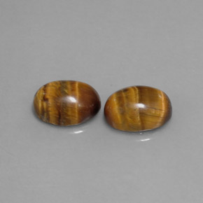 Gemas de tiger's eye marrón natural de  ct, corte óvalo, opaco