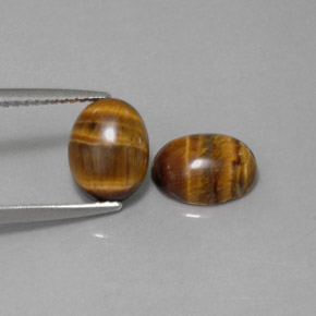 Gemas de tiger's eye marrón natural de  ct, corte óvalo, opaco