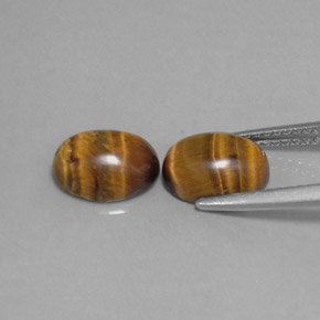 Gemas de tiger's eye marrón natural de  ct, corte óvalo, opaco