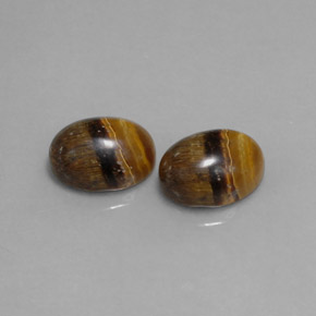 Gemas de tiger's eye marrón natural de  ct, corte óvalo, opaco