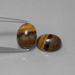 Gemas de tiger's eye marrón natural de  ct, corte óvalo, opaco