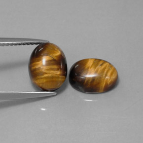 Gemas de tiger's eye marrón natural de  ct, corte óvalo, opaco