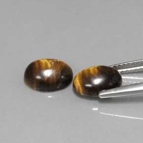 Gemas de tiger's eye marrón natural de  ct, corte óvalo, opaco