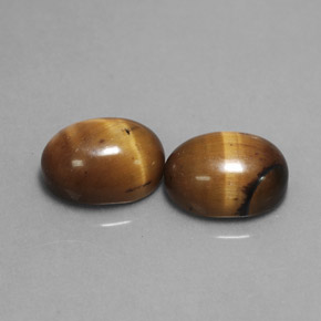 Gemas de tiger's eye marrón natural de  ct, corte óvalo, opaco