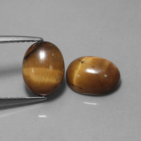 Gemas de tiger's eye marrón natural de  ct, corte óvalo, opaco