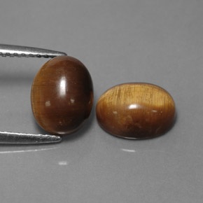 Gemas de tiger's eye marrón natural de  ct, corte óvalo, opaco
