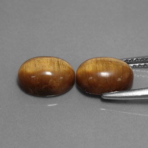 Gemas de tiger's eye marrón natural de  ct, corte óvalo, opaco
