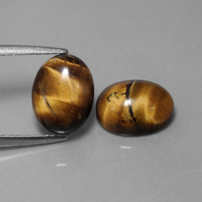 Gemas de tiger's eye marrón natural de  ct, corte óvalo, opaco