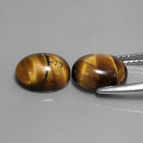 Gemas de tiger's eye marrón natural de  ct, corte óvalo, opaco