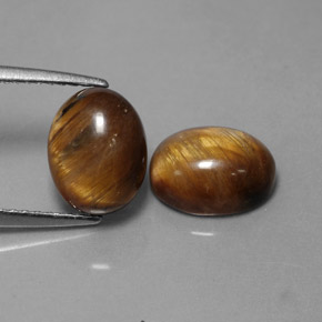 Gemas de tiger's eye marrón natural de  ct, corte óvalo, opaco