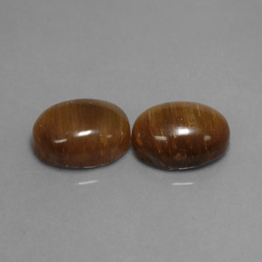 Gemas de tiger's eye marrón natural de  ct, corte óvalo, opaco