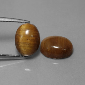 Gemas de tiger's eye marrón natural de  ct, corte óvalo, opaco