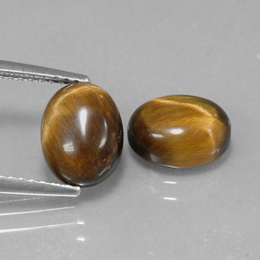 Gemas de tiger's eye marrón natural de  ct, corte óvalo, opaco