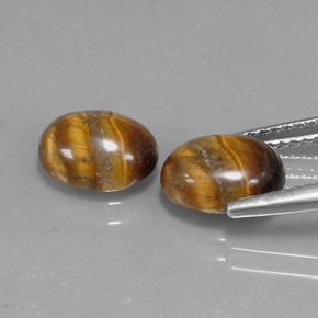 Gemas de tiger's eye marrón natural de  ct, corte óvalo, opaco