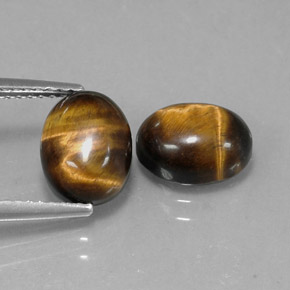 Gemas de tiger's eye marrón natural de  ct, corte óvalo, opaco