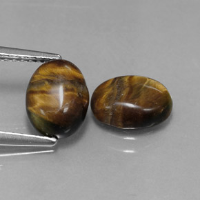 Gemas de tiger's eye marrón natural de  ct, corte óvalo, opaco