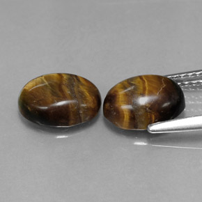 Gemas de tiger's eye marrón natural de  ct, corte óvalo, opaco