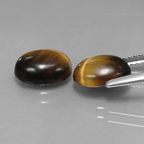 Gemas de tiger's eye marrón natural de  ct, corte óvalo, opaco