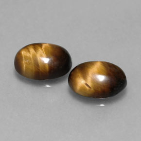 Gemas de tiger's eye marrón natural de  ct, corte óvalo, opaco