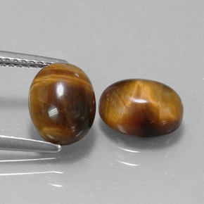 Gemas de tiger's eye marrón natural de  ct, corte óvalo, opaco