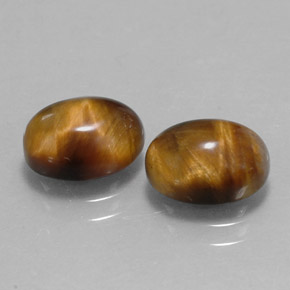 Gemas de tiger's eye marrón natural de  ct, corte óvalo, opaco