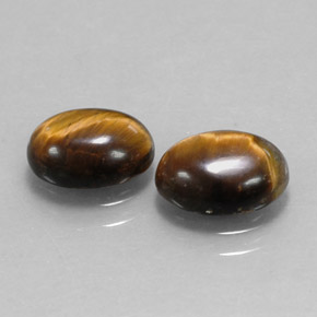 Gemas de tiger's eye marrón natural de  ct, corte óvalo, opaco