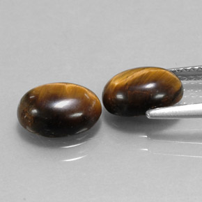 Gemas de tiger's eye marrón natural de  ct, corte óvalo, opaco