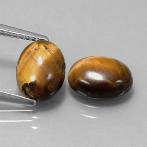 Gemas de tiger's eye marrón natural de  ct, corte óvalo, opaco