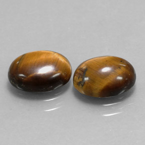 Gemas de tiger's eye marrón natural de  ct, corte óvalo, opaco