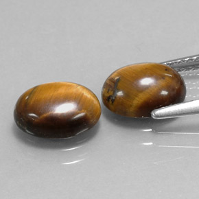 Gemas de tiger's eye marrón natural de  ct, corte óvalo, opaco
