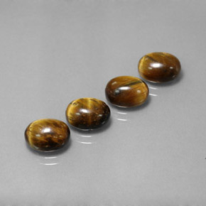Gemas de tiger's eye marrón natural de  ct, corte óvalo, opaco